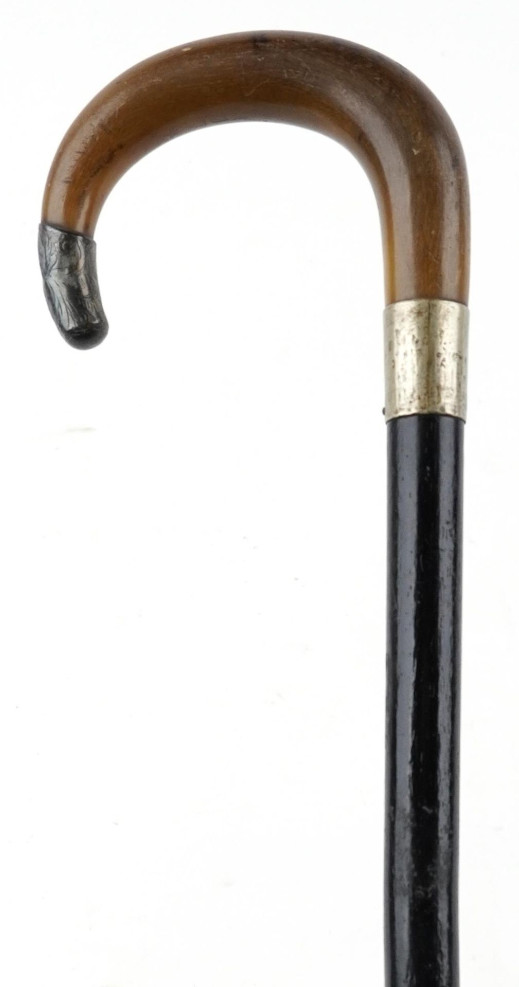Ebonised walking stick with horn handle and silver mount, the horn handle possibly rhinoceros,
