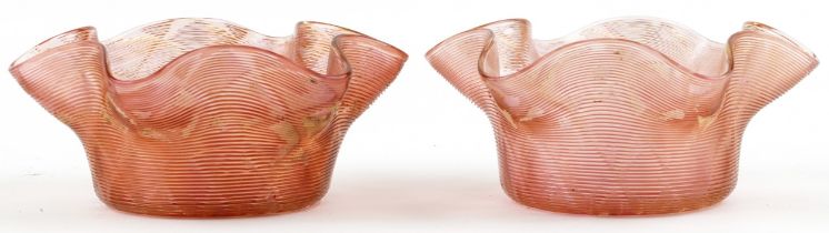Pair of Stuart and Son's gilt and peach glass finger bowls, each 14cm in diameter