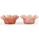 Pair of Stuart and Son's gilt and peach glass finger bowls, each 14cm in diameter