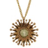 9ct gold green spinel solitaire starburst pendant on a 9ct gold necklace, 2cm in diameter and 40cm