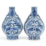 Pair of Chinese blue and white porcelain moon flasks with animalia handles each hand painted with