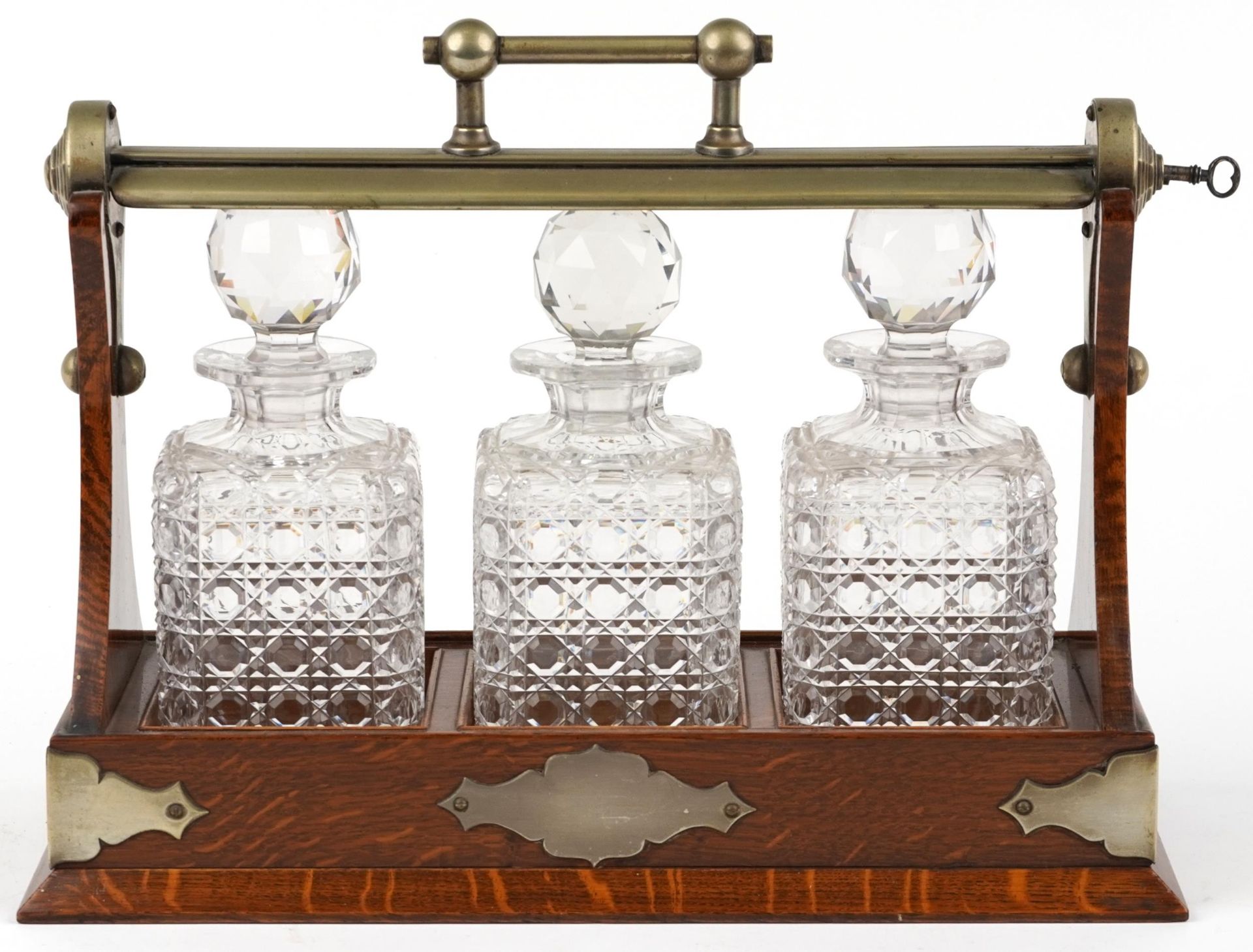 Edwardian oak Grimsell's Patent tantalus housing three cut glass decanters, 40cm wide : For - Image 2 of 5