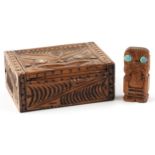 New Zealand Maori carvings including a rectangular box with hinged lid and abalone inlay, the