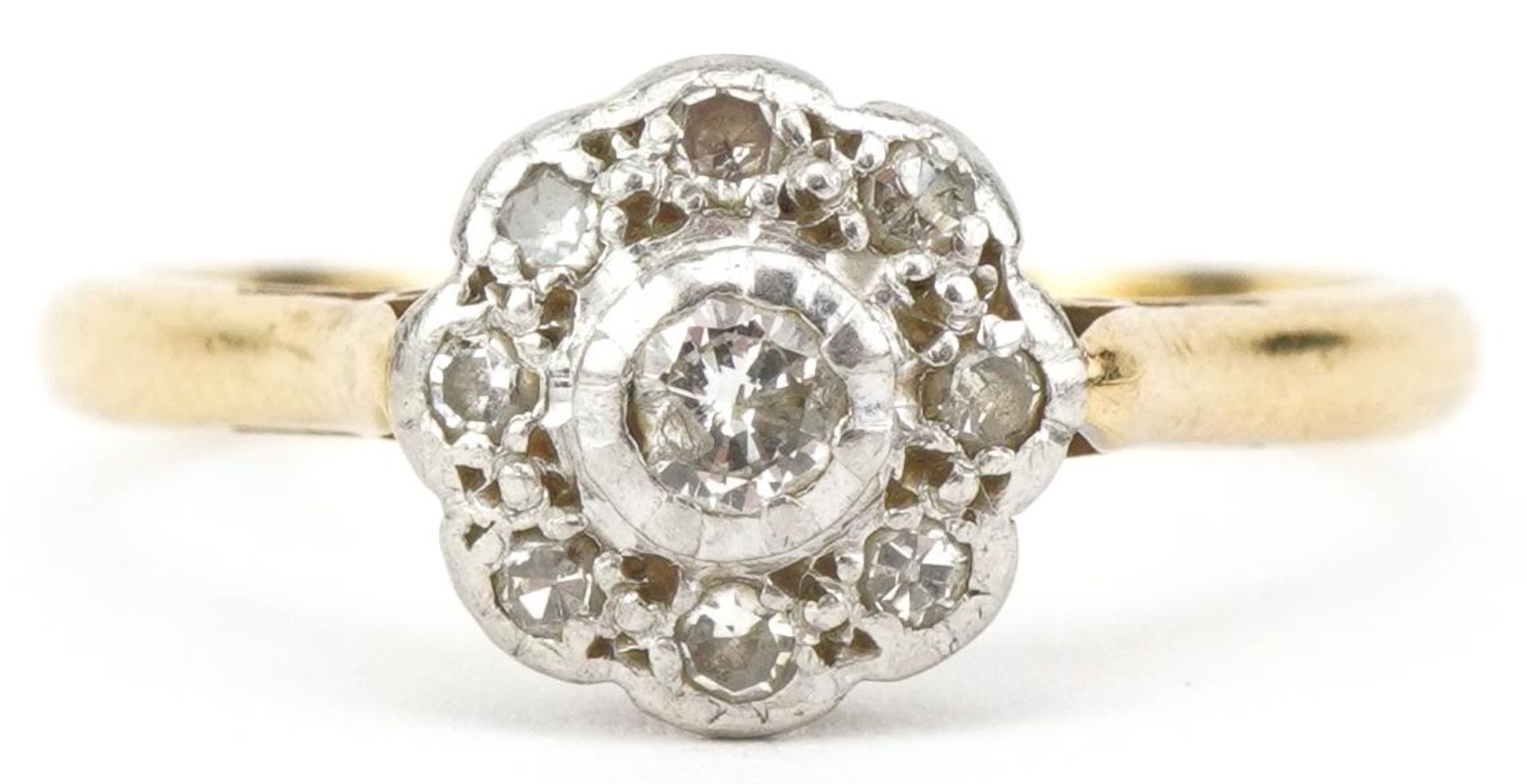 18ct gold and platinum diamond flower head ring, the central diamond approximately 2.50mm in