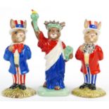 Three Royal Doulton Bunnykins figures comprising two Uncle Sam Bunnykins and Statue of Liberty