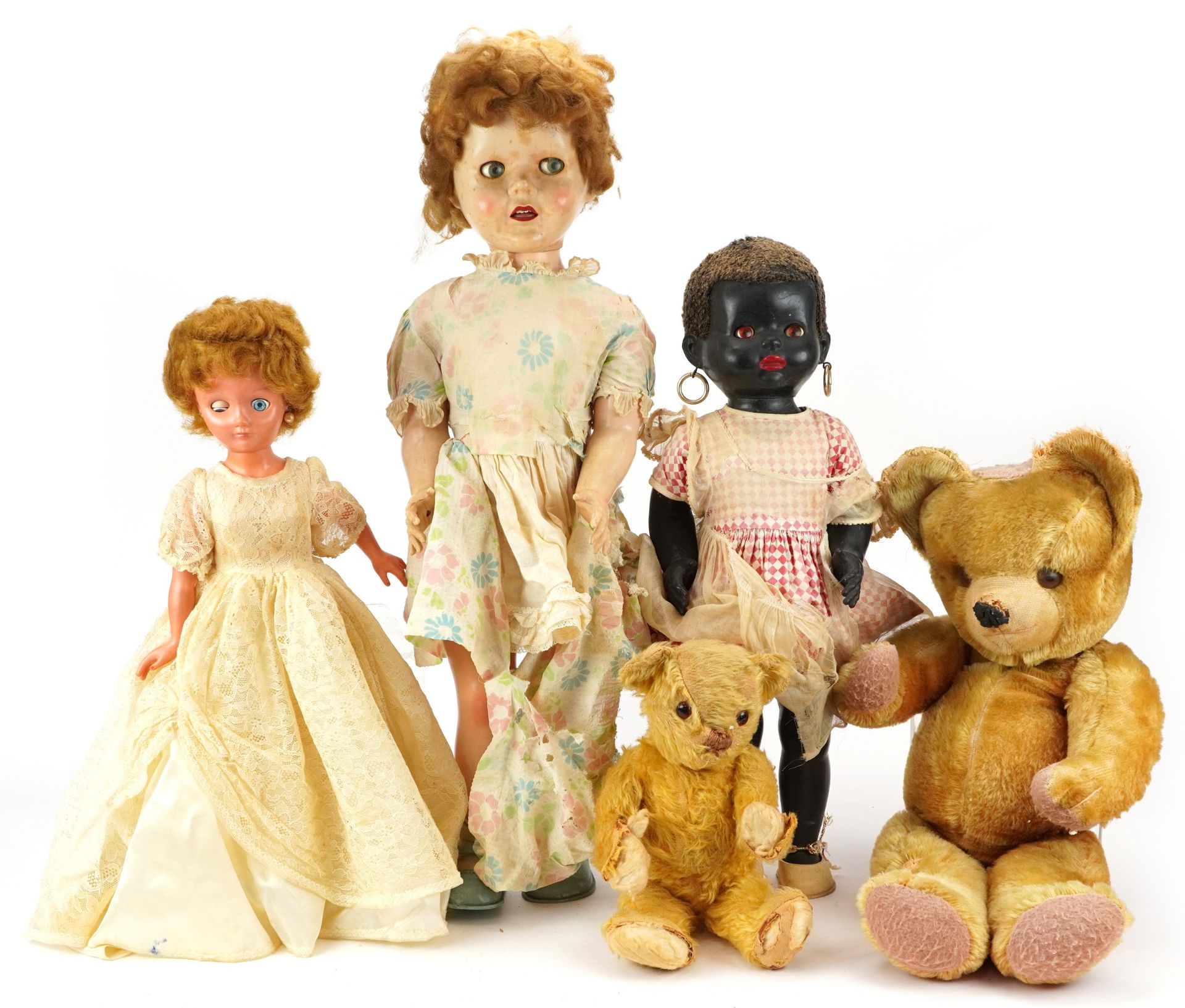 Three vintage dolls including a 28 inch Pedigree example and two golden teddy bears with jointed