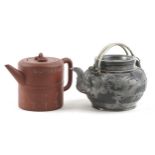 Two Chinese teapots including Yixing terracotta example with liner, the largest 18cm in length : For