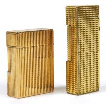 Two gold plated pocket lighters comprising S J Dupont with box and Dunhill : For further information