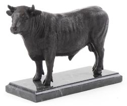 Patinated bronze study of a bull raised on a black marble base, 24cm in length : For further