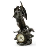 Verdigris patinated spelter mantle clock in the form of Saint Michael and demon, having circular