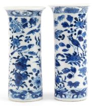 Two Chinese blue and white porcelain cylindrical vases hand painted with birds amongst flowers and