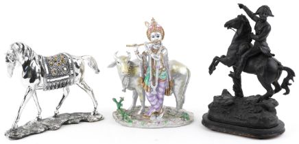 Three horse sculptures including a patinated spelter example of a soldier on horseback, the