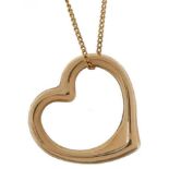 Unmarked gold love heart pendant on a 9ct gold necklace, the pendant tests as 9ct gold, 1.5cm