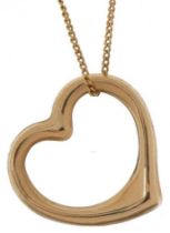 Unmarked gold love heart pendant on a 9ct gold necklace, the pendant tests as 9ct gold, 1.5cm