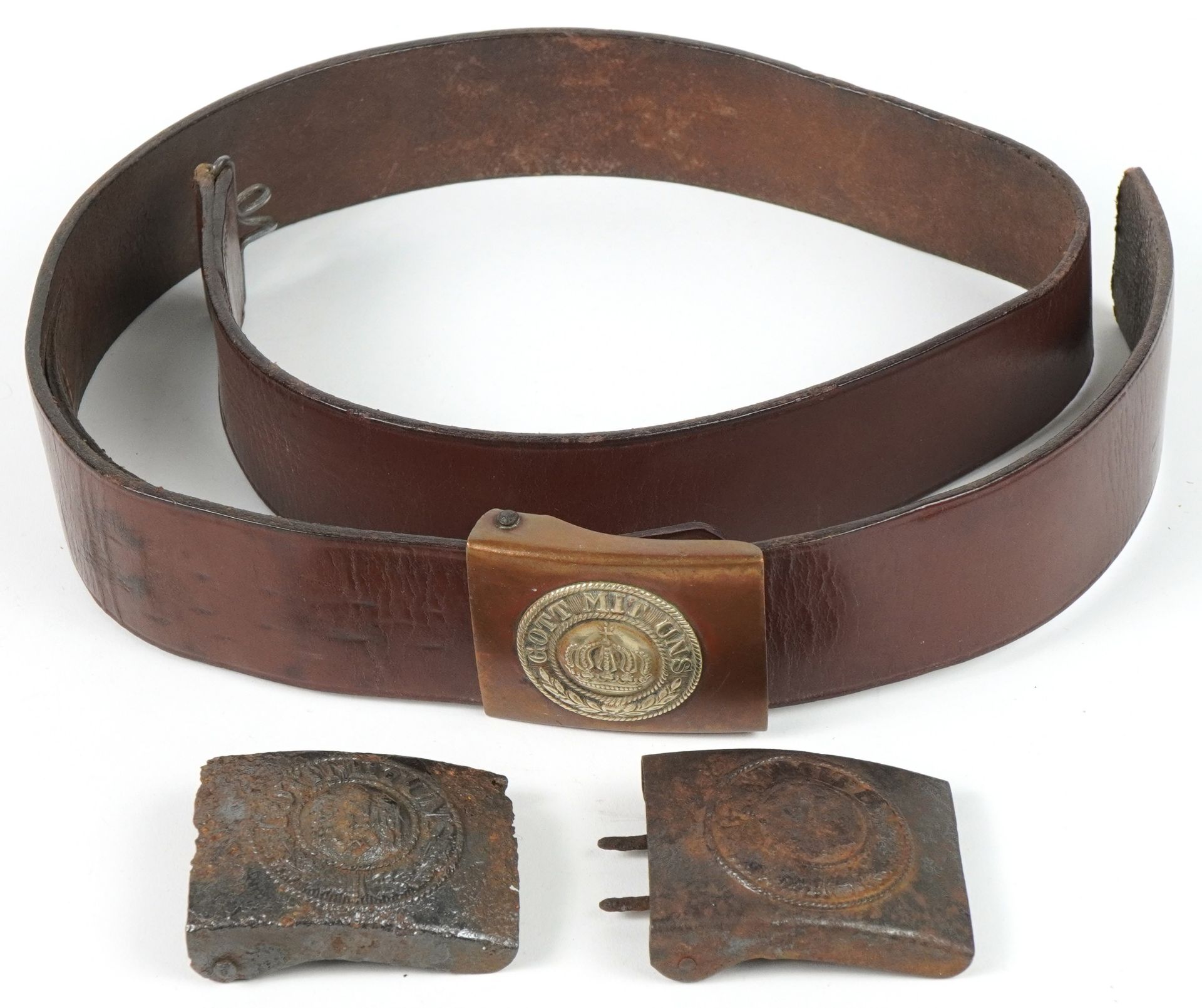 Three German military interest buckles including one on leather belt : For further information on