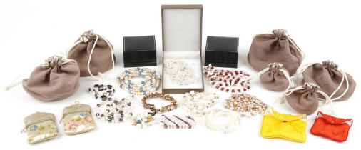 Collection of freshwater pearl and semi precious stone necklaces and bracelets, some housed in