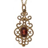 9ct gold garnet openwork pendant on a 9ct gold necklace, 2.5cm high and 48cm in length, 1.6g : For