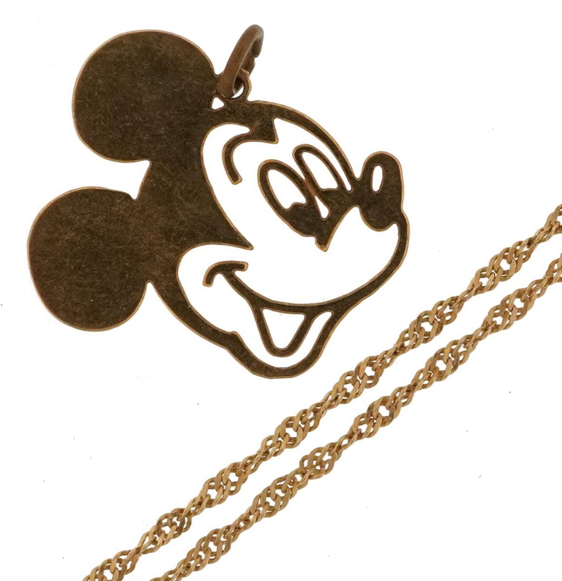 18ct gold rope twist necklace and a yellow metal Disney Mickey Mouse pendant, the necklace 48cm in