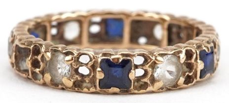 Unmarked gold sapphire and white spinel eternity ring, tests as 9ct gold, size L/M, 2.2g : For
