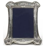 Carrs, Elizabeth II silver easel photo frame embossed with swags and flowers, Sheffield 1995, 18cm x
