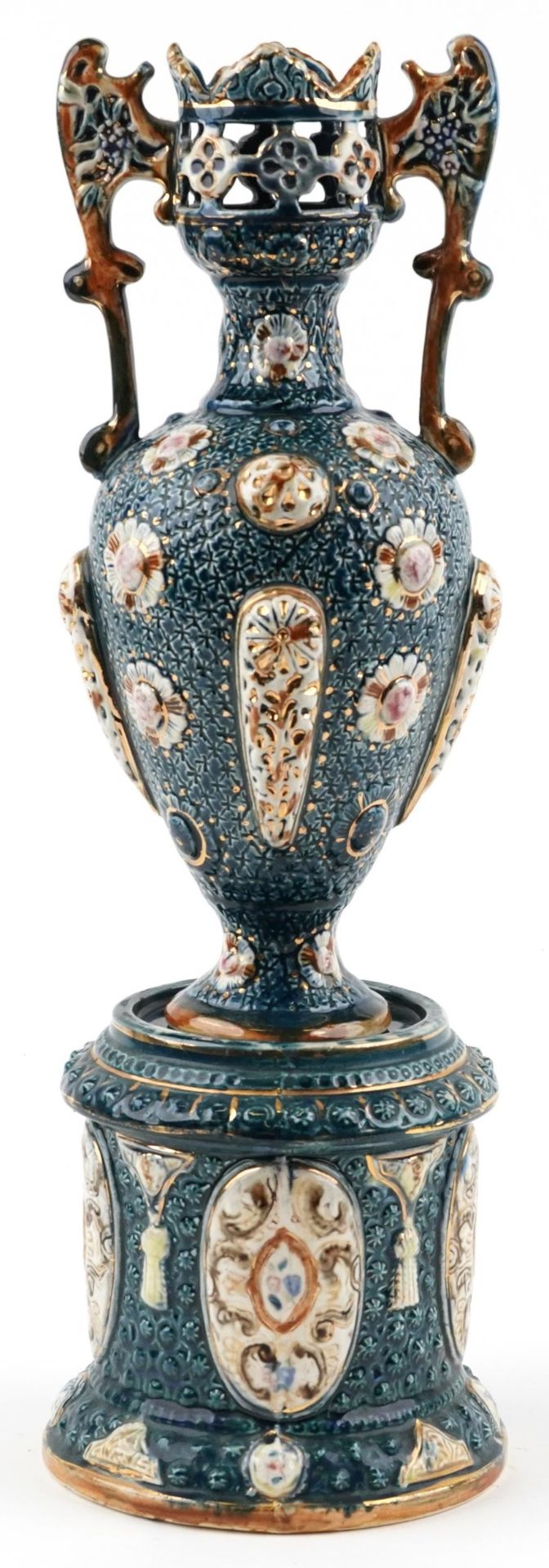 Continental Maiolica pierced vase with twin handles on a circular base, the vase and base each