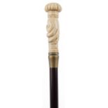 Hardwood walking stick with carved bone hand design pommel, 90cm in length : For further information