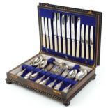 Victorian and later silver cutlery, predominantly by James Dixon & Sons Ltd, housed in an oak