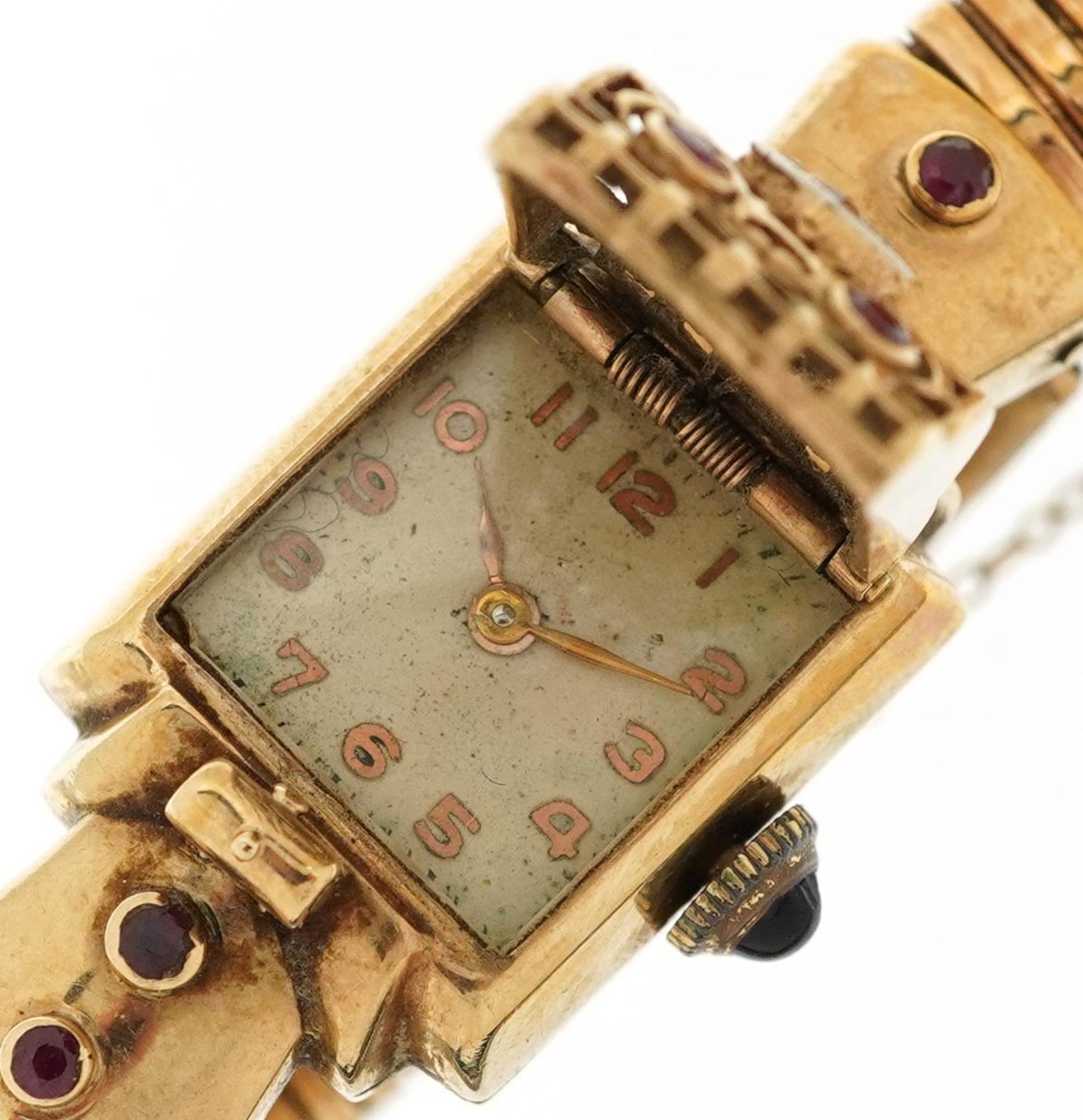 Ladies 9ct gold bracelet wristwatch set with a diamond, rubies and sapphire crown, the case 16mm