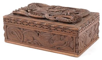 Chinese hardwood jewellery chest having lift out interior and hinged lid deeply carved a dragon,