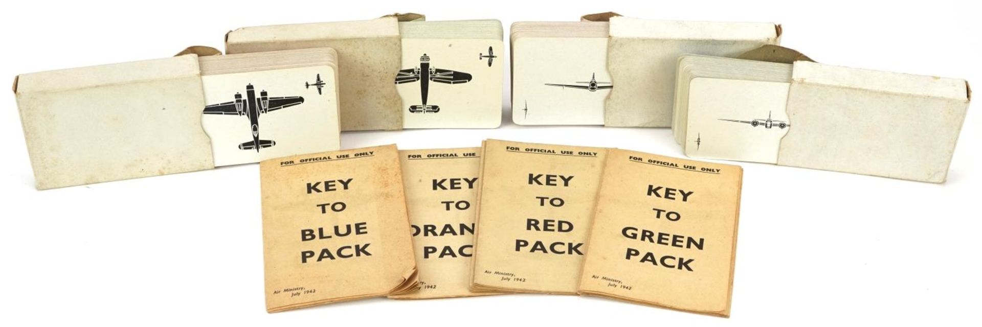 Four packs of military interest playing cards including Key to Blue pack and Key to Green pack : For