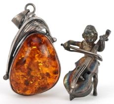 Naturalistic silver and amber pendant and a miniature silver figure of Putti playing a cello, 5cm