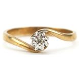 Unmarked gold diamond solitaire crossover ring, tests as 9ct gold, size P/Q, 2.3g : For further