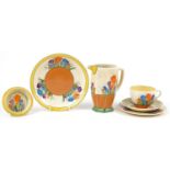 Clarice Cliff, Art Deco Bizarre Crocus pattern china comprising jug, trio, bowl and dish, the