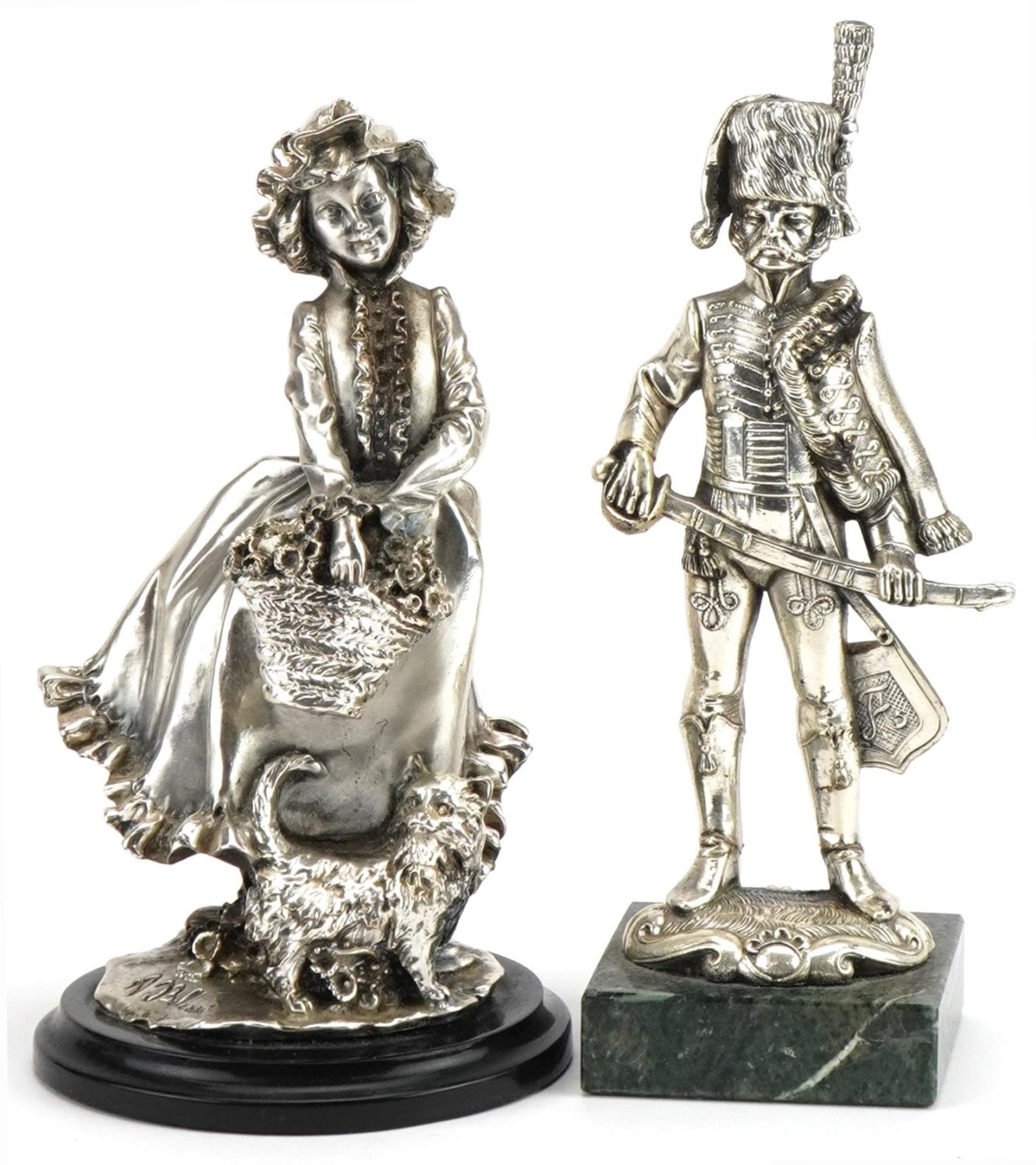 Brunel, Italian silver filled figure of a Dutch girl with kitten and a similar example of a