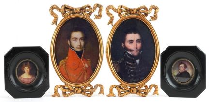 Two pairs of portrait miniatures including a pair with gilt bow design frames, the largest overall