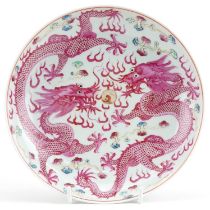 Chinese porcelain shallow dish hand painted with two dragons chasing the flaming pearl amongst