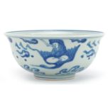 Chinese blue and white porcelain bowl hand painted with figures and animals above crashing waves,