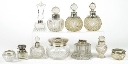 Victorian and later silver mounted cut glass scent bottles, inkwells and jars, the largest 11.5cm