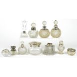 Victorian and later silver mounted cut glass scent bottles, inkwells and jars, the largest 11.5cm