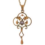 Edwardian 9ct gold purple stone openwork pendant on a yellow metal necklace, the pendant 4.4cm high,