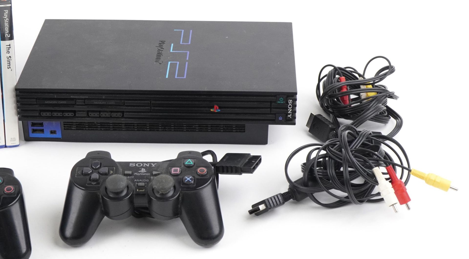 Two Sony PlayStation 2 games consoles with controllers and a collection of games : For further - Image 4 of 4