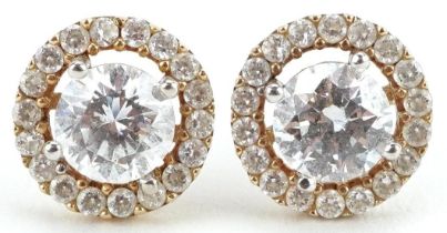 Pair of unmarked gold clear stone cluster stud earrings, tests as 9ct gold, 9mm in diameter, 1.