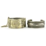 Two Middle Eastern white metal bangles, the largest 6cm in diameter, total 100.8g : For further