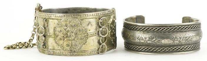 Two Middle Eastern white metal bangles, the largest 6cm in diameter, total 100.8g : For further