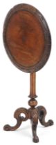 Victorian carved walnut tilt top occasional table with tripod base, 68cm high x 50cm in diameter :