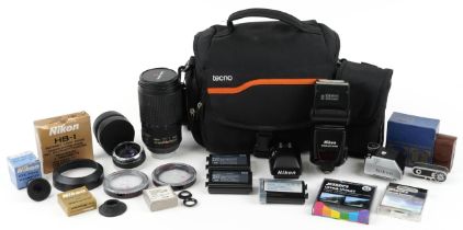 Camera lenses and accessories including Nikon 70-300 VR lens, metred head for Nikon F and DP-30 head