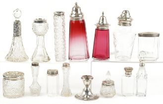 Victorian and later silver mounted glassware including cranberry glass casters, scent bottles and