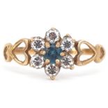 9ct gold cubic zirconia and blue stone flower head ring with pierced love heart shoulders, size N,