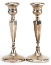 Pair of Edwardian hexagonal tapering candlesticks, indistinct maker's mark Birmingham 1921, 16cm