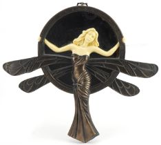 Art Nouveau style bronzed and ivorine wall mirror in the form of a fairy, 29cm high : For further